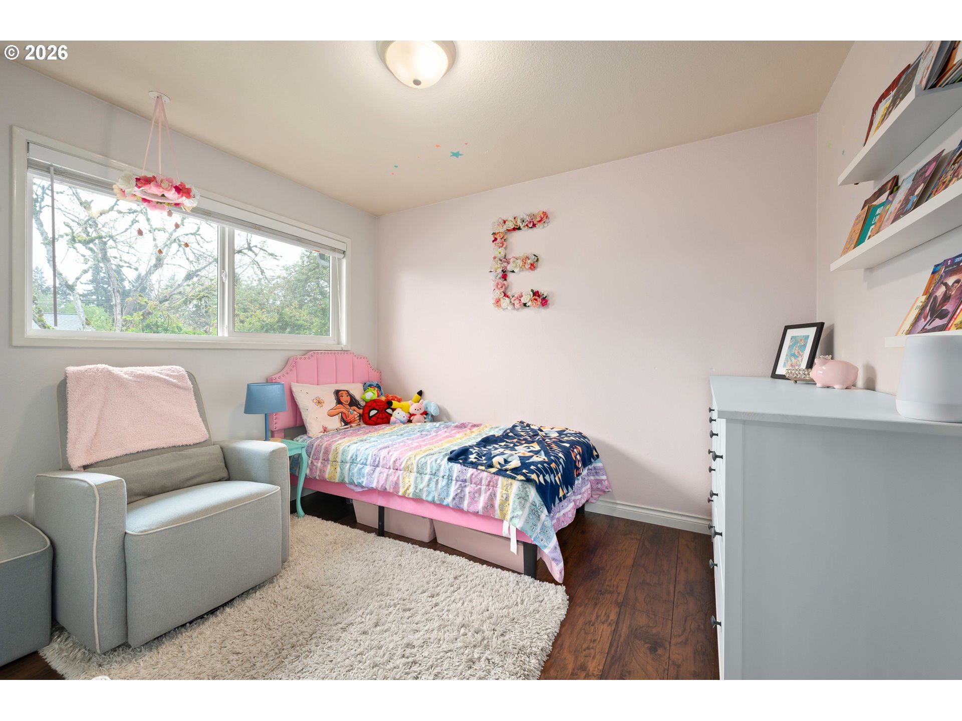 2463 Moore Street Eugene, OR 97404 - Photo 22 of 34 a bedroom with furniture and a wooden floor