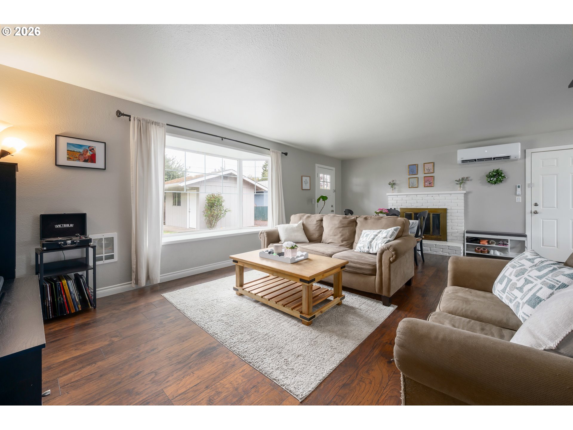 2463 Moore Street Eugene, OR 97404 - Photo 6 of 34 a living room with furniture window and wooden floor