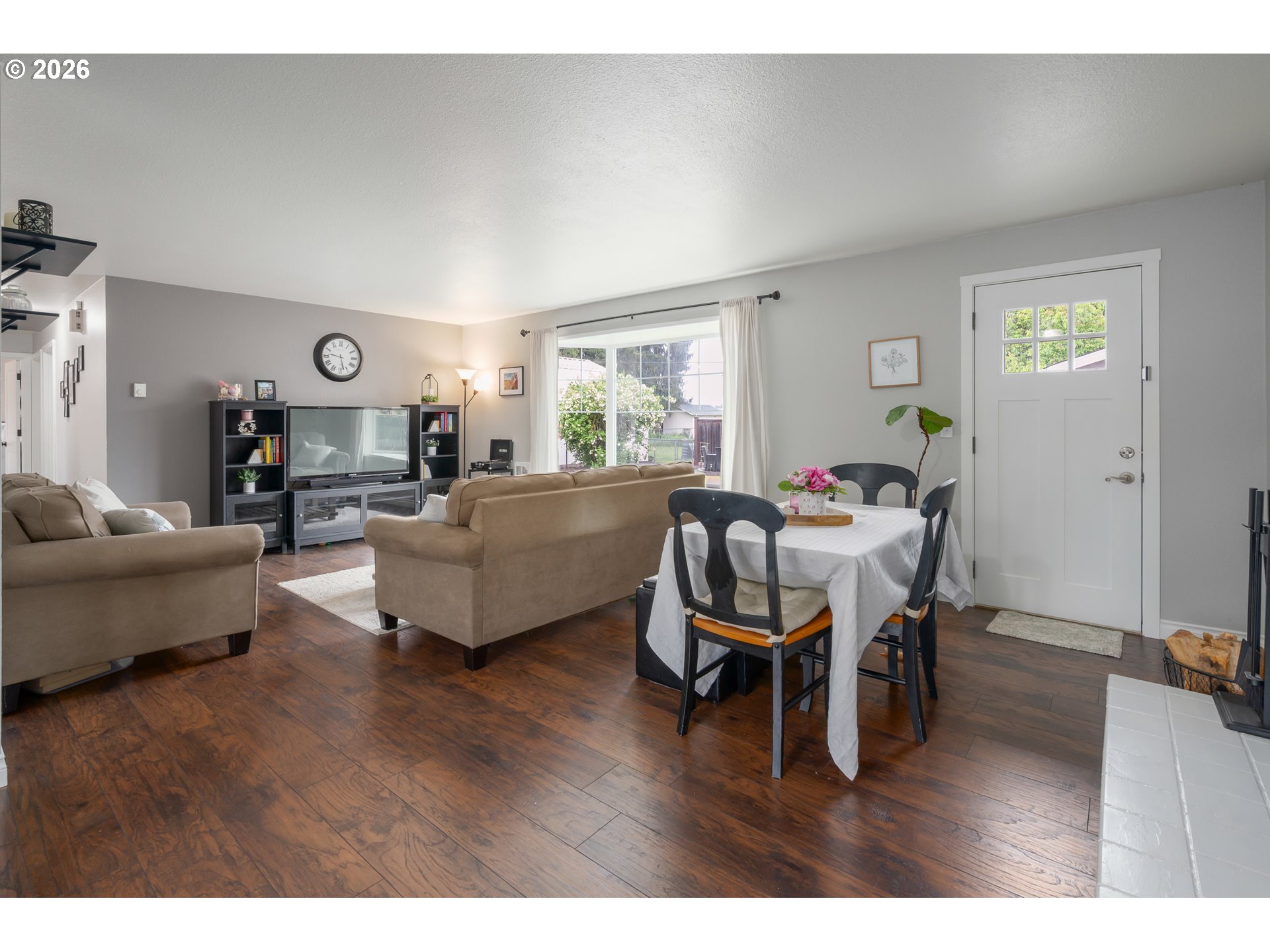 2463 Moore Street Eugene, OR 97404 - Photo 10 of 34 a living room with furniture wooden floor and a window
