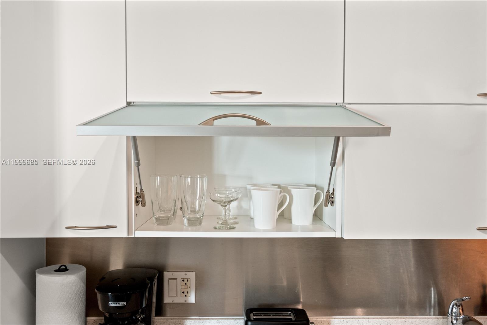 234 Northeast 3rd Street, Unit 1704 Miami, FL 33132 - Photo 20 of 35 a close view of shoes stand and cabinets