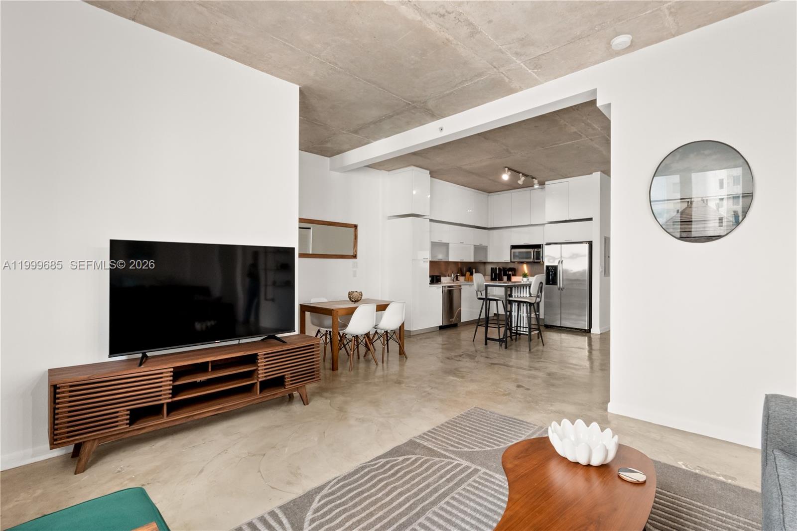 234 Northeast 3rd Street, Unit 1704 Miami, FL 33132 - Photo 22 of 35 a room with furniture and a flat screen tv