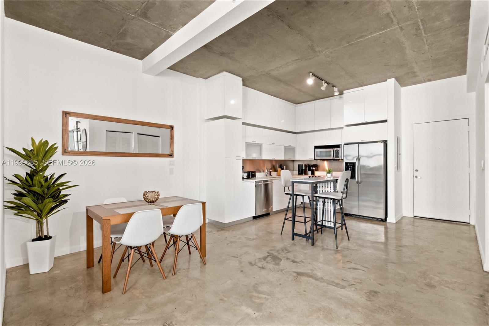 234 Northeast 3rd Street, Unit 1704 Miami, FL 33132 - Photo 5 of 35 a view of a dining room with furniture