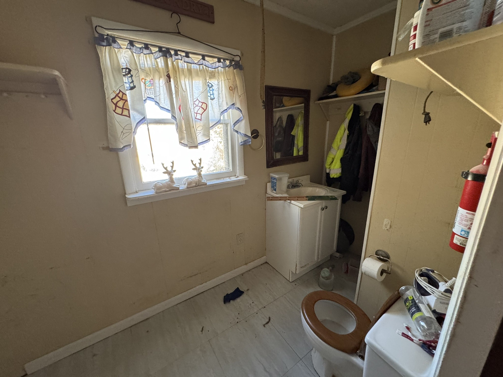 7415 Rock Creek Road Tullahoma, TN 37388 - Photo 13 of 27 a view of storage and utility room with a window