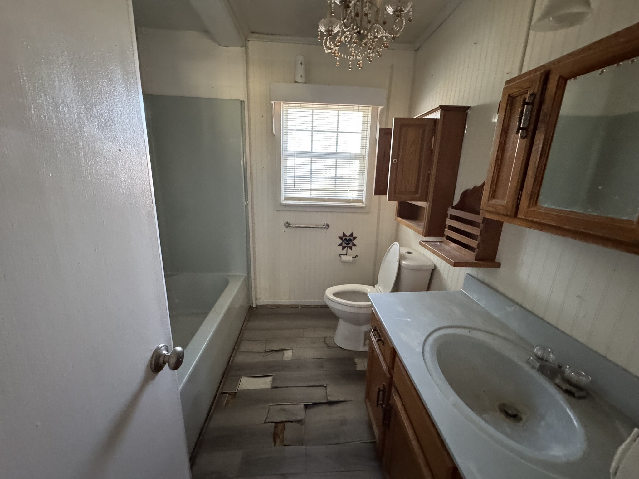 7415 Rock Creek Road Tullahoma, TN 37388 - Photo 16 of 27 a bathroom with toilet sink and mirror