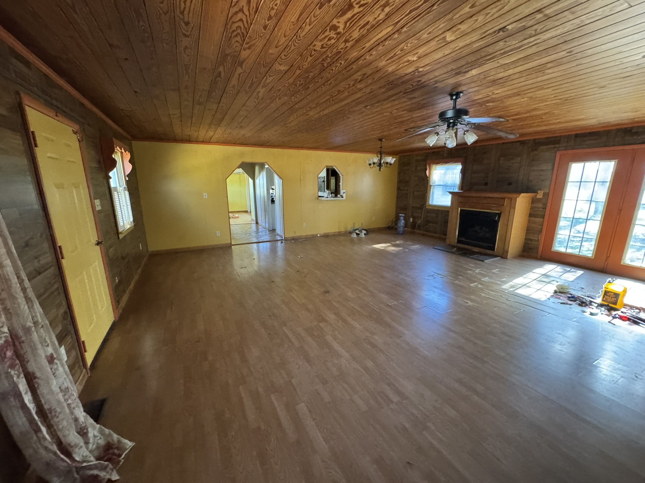 7415 Rock Creek Road Tullahoma, TN 37388 - Photo 19 of 27 a view of a livingroom with wooden floor and a ceiling fan