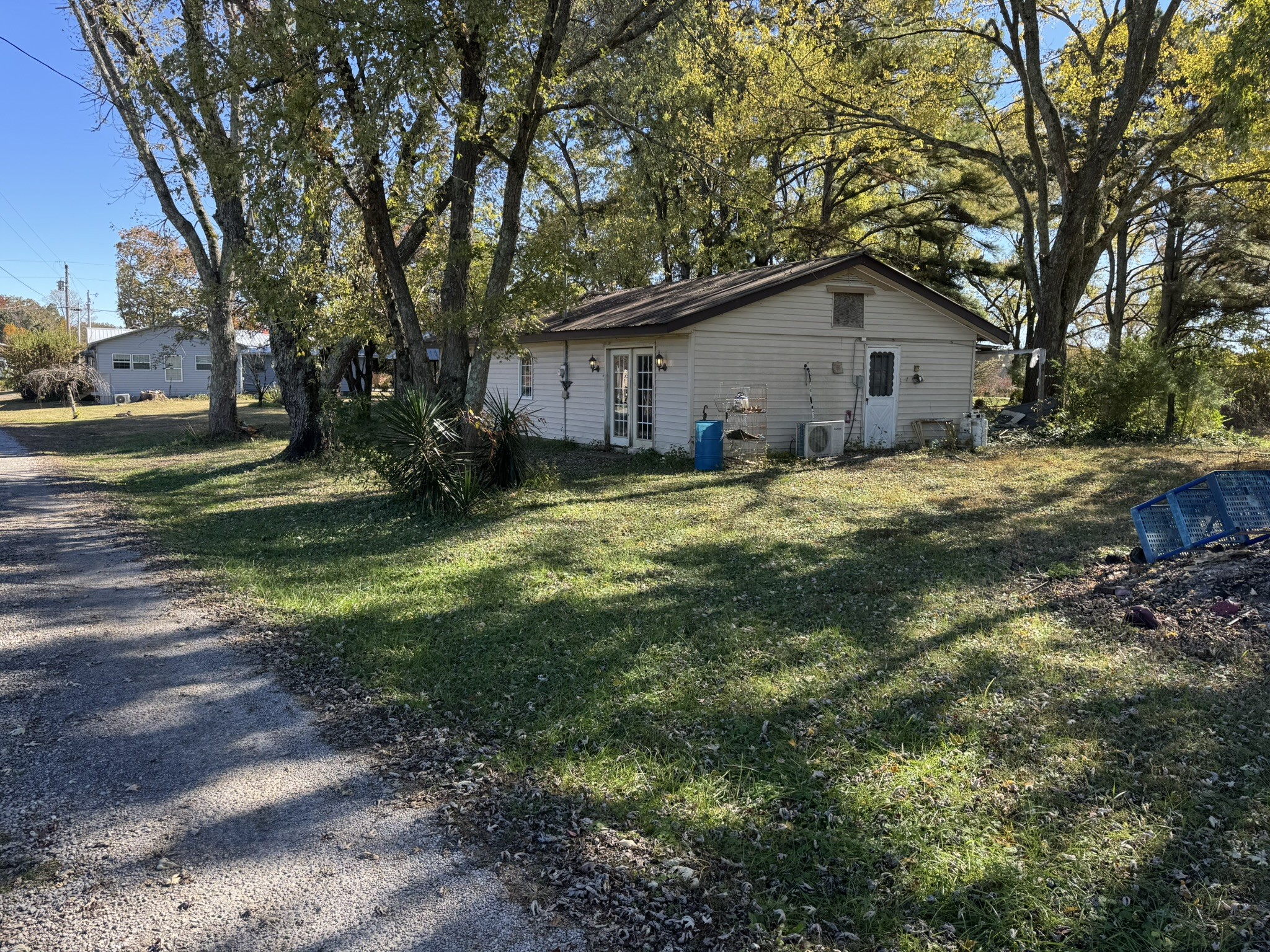 7415 Rock Creek Road Tullahoma, TN 37388 - Photo 24 of 27 a house with a big yard and large trees