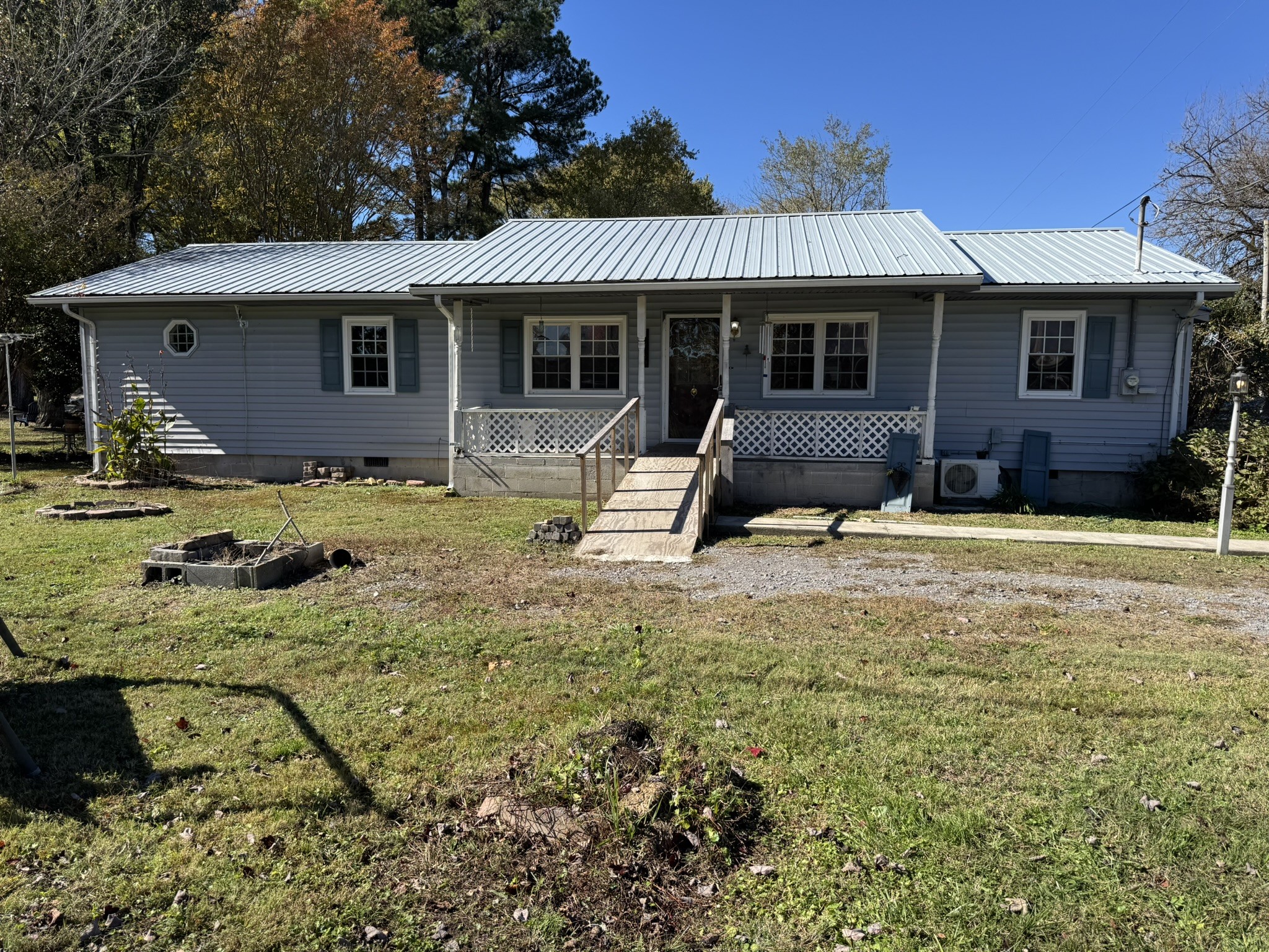 7415 Rock Creek Road Tullahoma, TN 37388 - Photo 4 of 27 a view of a house with backyard and sitting area