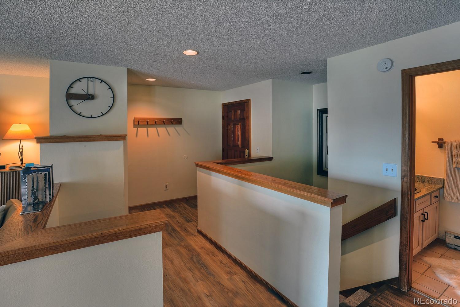 1680 Ranch Road, Unit 203 Steamboat Springs, CO 80487 - Photo 11 of 25 a view of kitchen with cabinets and wooden floor