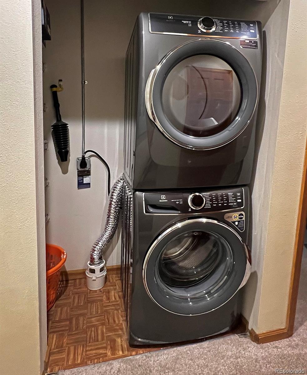 1680 Ranch Road, Unit 203 Steamboat Springs, CO 80487 - Photo 21 of 25 a utility room with dryer and washer