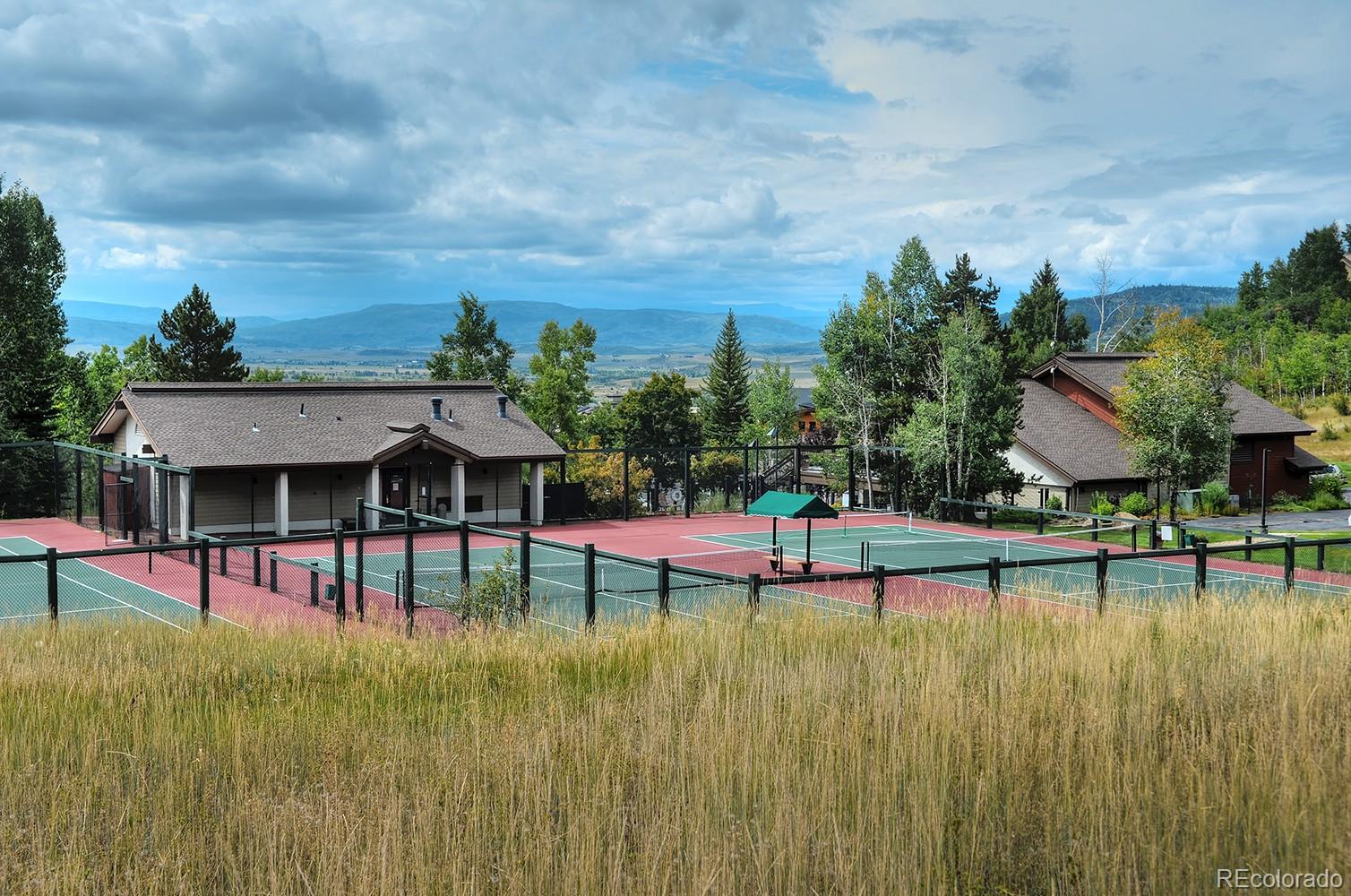 1680 Ranch Road, Unit 203 Steamboat Springs, CO 80487 - Photo 24 of 25 a view of a swimming pool with a yard