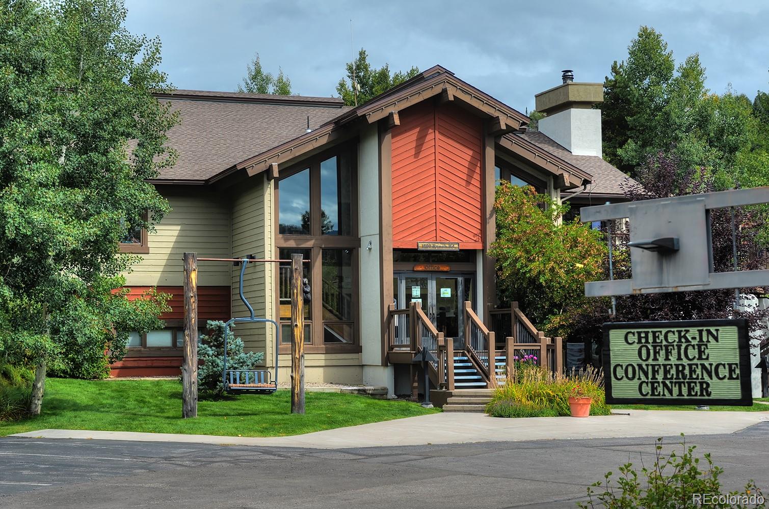 1680 Ranch Road, Unit 203 Steamboat Springs, CO 80487 - Photo 25 of 25 a front view of a house with garden