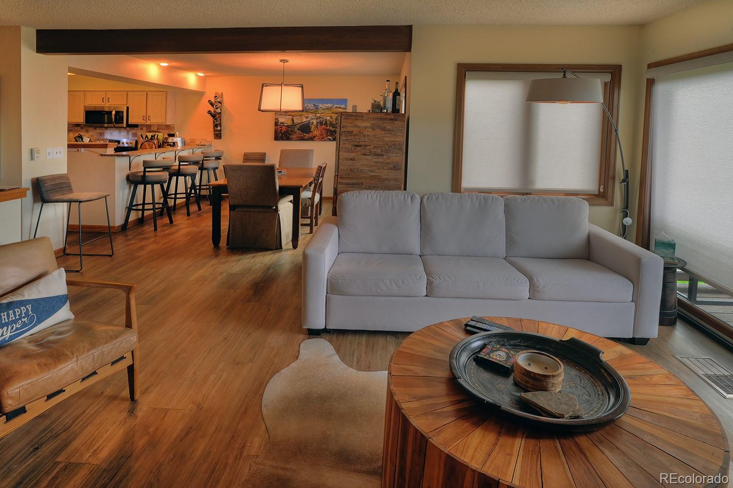 1680 Ranch Road, Unit 203 Steamboat Springs, CO 80487 - Photo 6 of 25 a living room with furniture and wooden floor