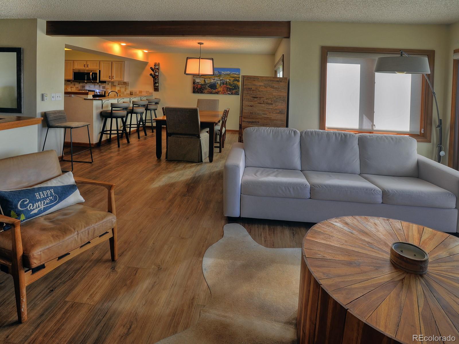 1680 Ranch Road, Unit 203 Steamboat Springs, CO 80487 - Photo 7 of 25 a living room with furniture and view of kitchen