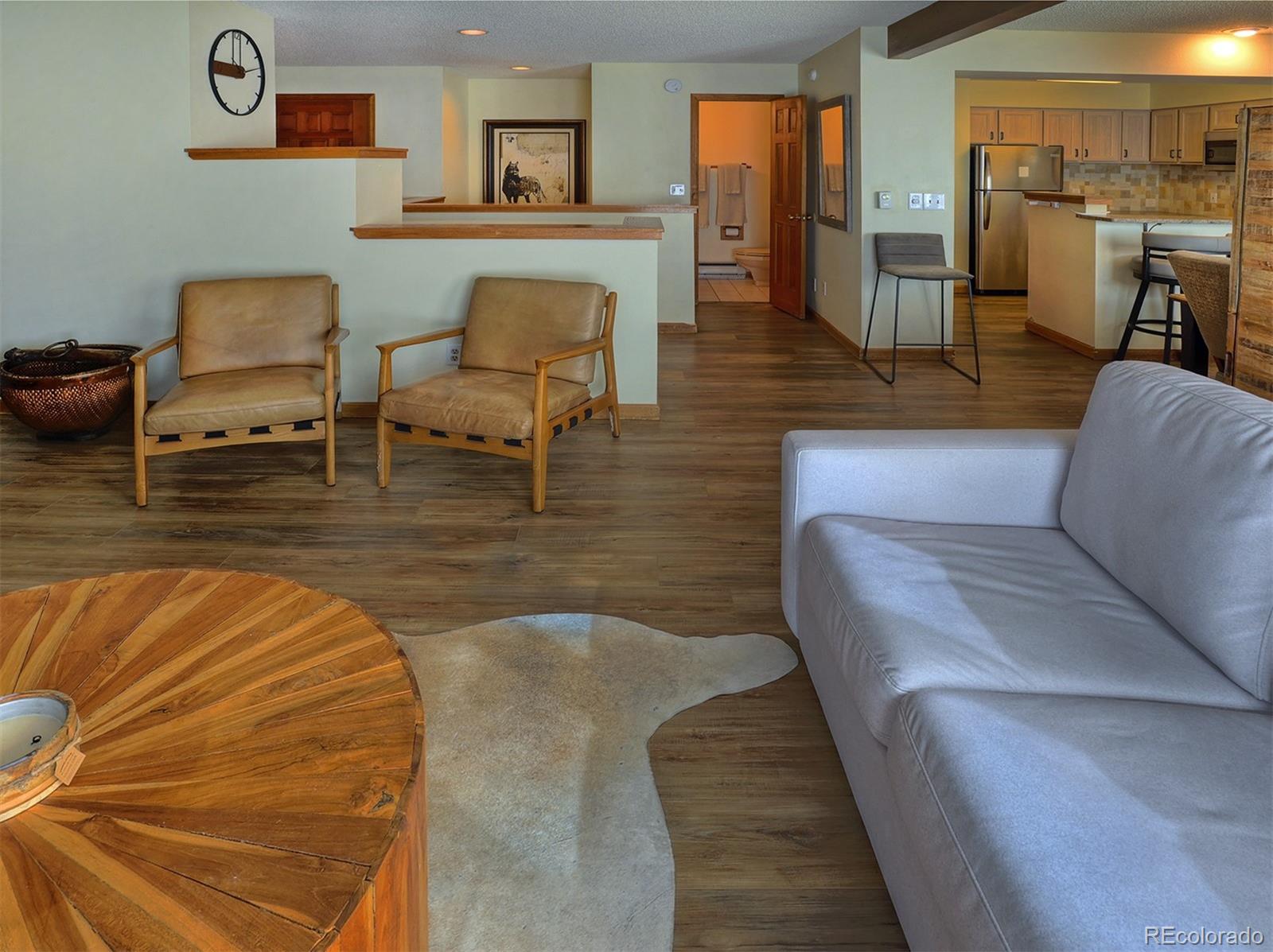 1680 Ranch Road, Unit 203 Steamboat Springs, CO 80487 - Photo 10 of 25 a living room with furniture and a wooden floor