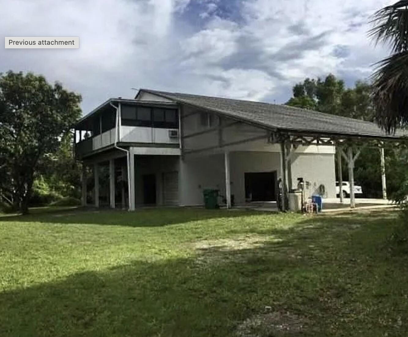 801 Tilton Road Port St. Lucie, FL 34952 - Photo 1 of 23 a view of a house with a yard and sitting area