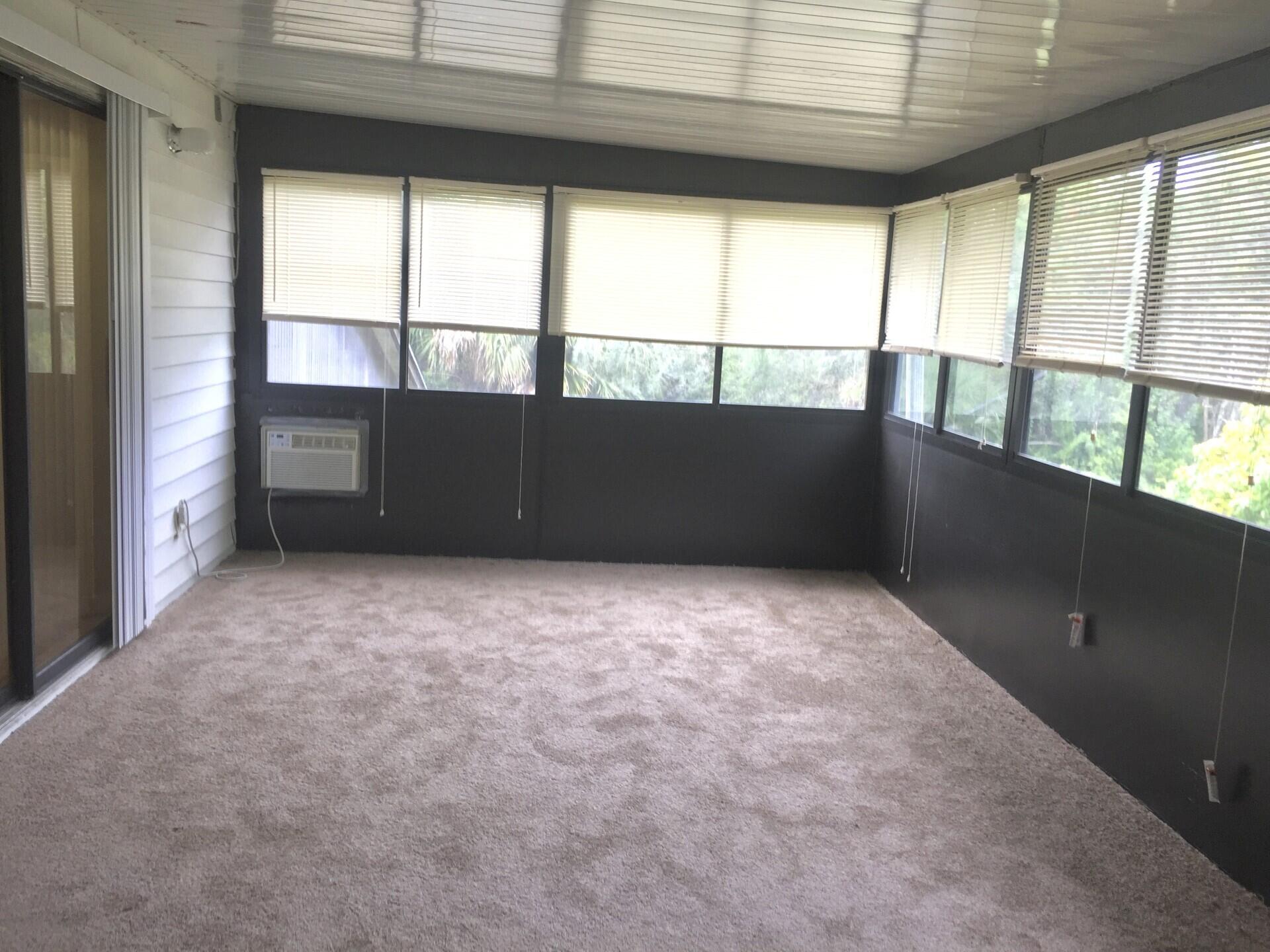 801 Tilton Road Port St. Lucie, FL 34952 - Photo 16 of 23 a view of an empty room with a window