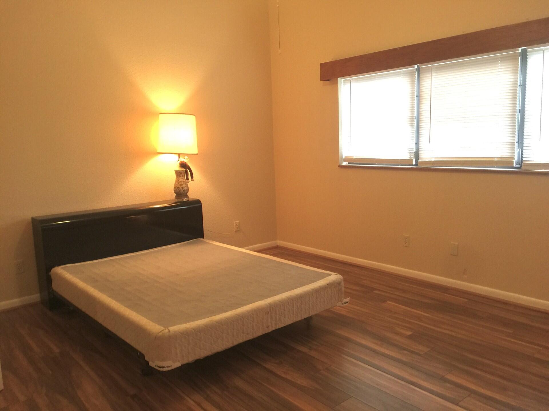 801 Tilton Road Port St. Lucie, FL 34952 - Photo 17 of 23 a room with a bed and a window