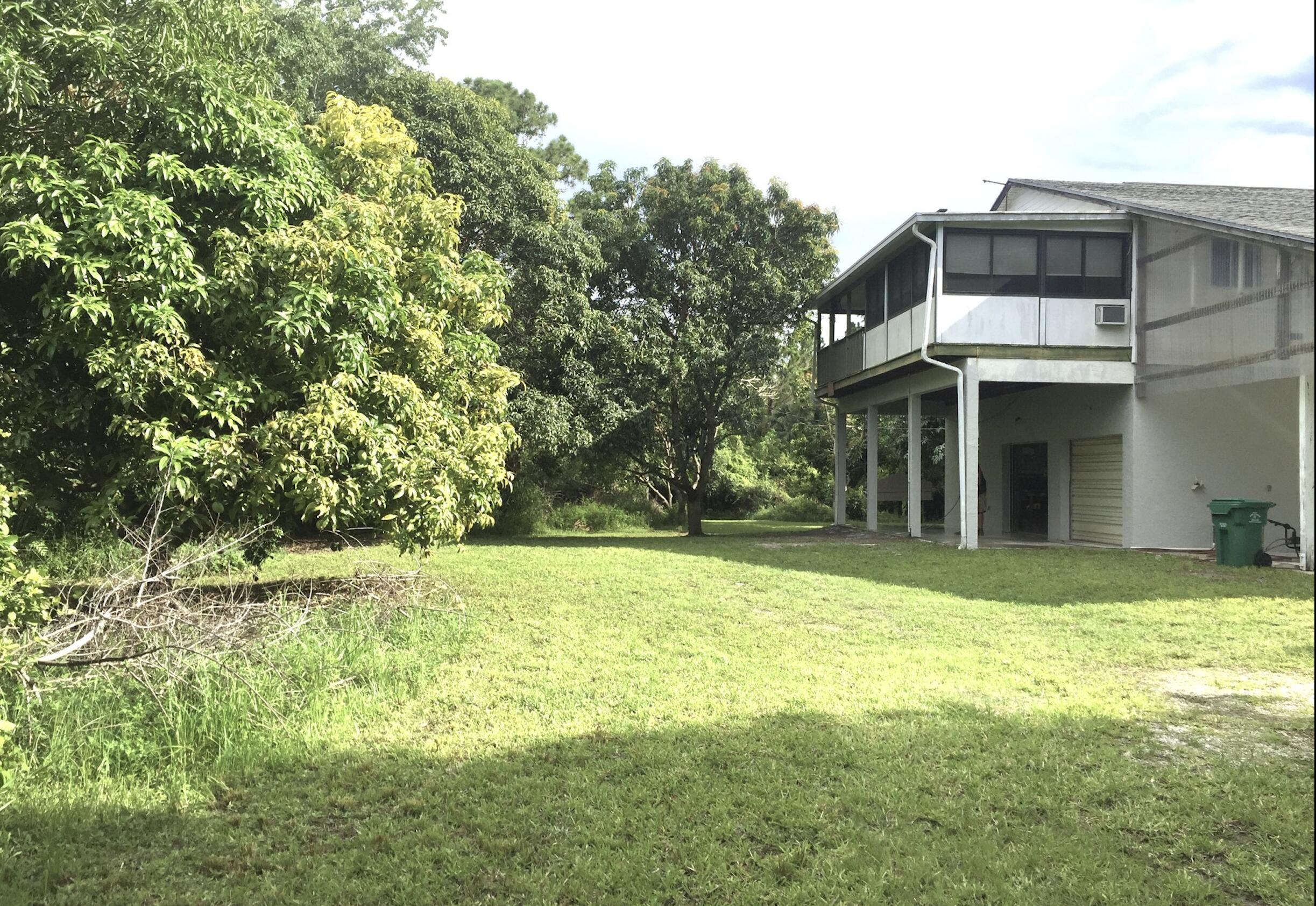 801 Tilton Road Port St. Lucie, FL 34952 - Photo 5 of 23 a front view of a house with a yard