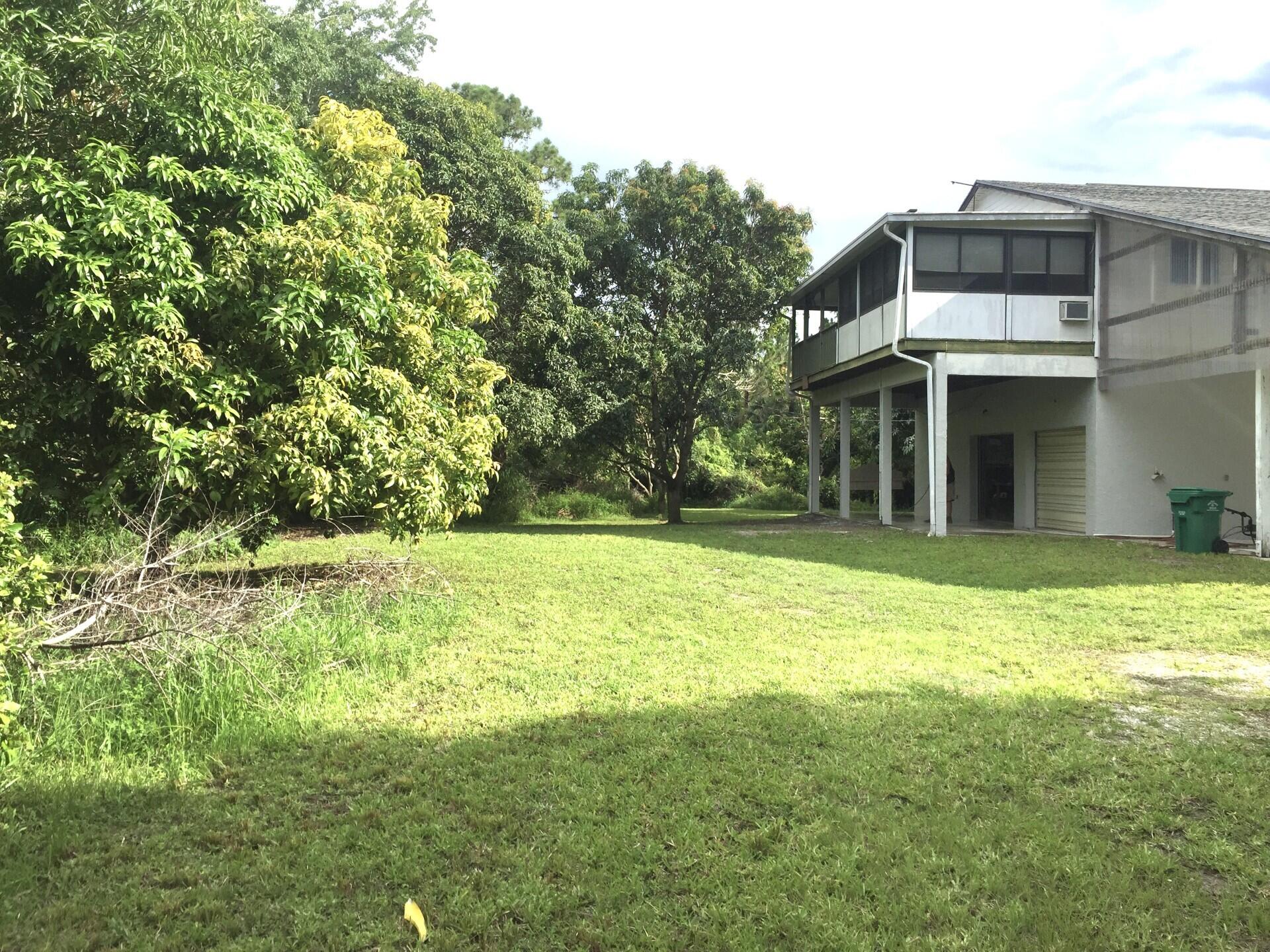 801 Tilton Road Port St. Lucie, FL 34952 - Photo 10 of 23 a view of a house with a yard