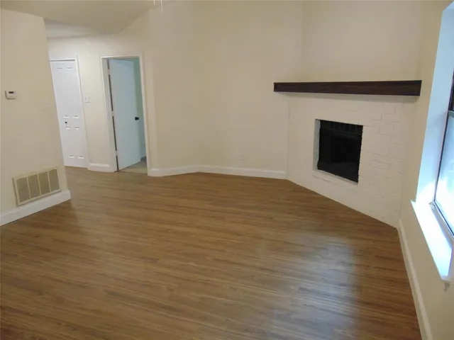 a kitchen with granite countertop a stove a sink and a microwave