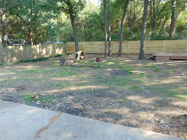 a view of backyard with tree