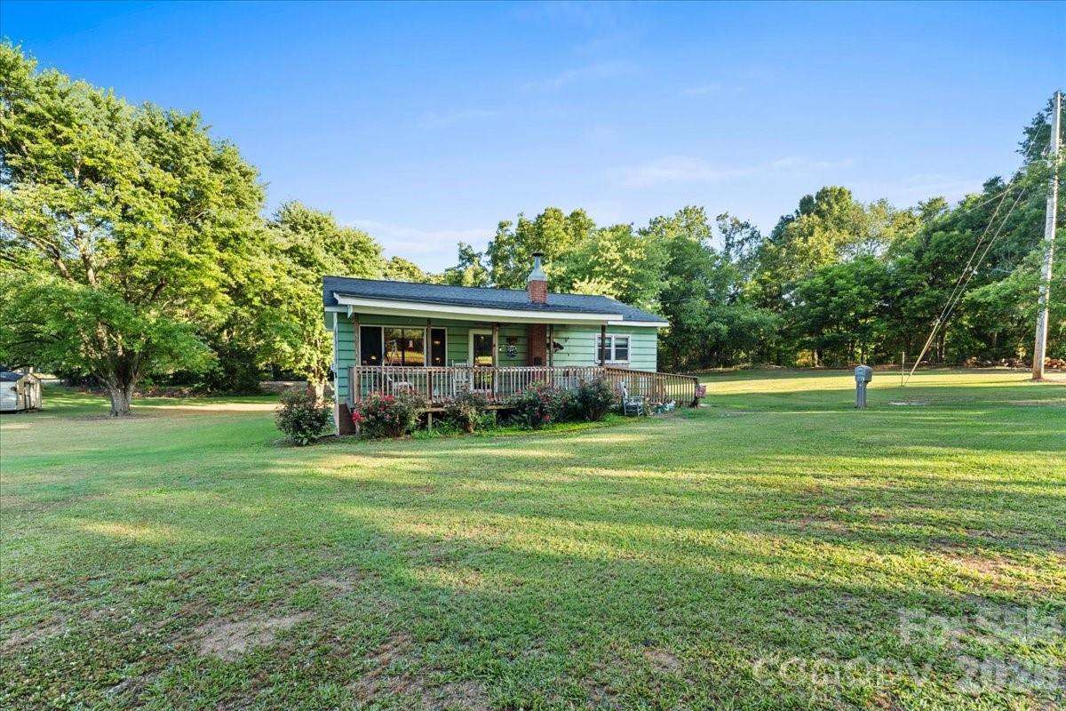 12282 Coyle Road Stanfield, NC 28163 - Photo 18 of 24 a front view of a house with a yard