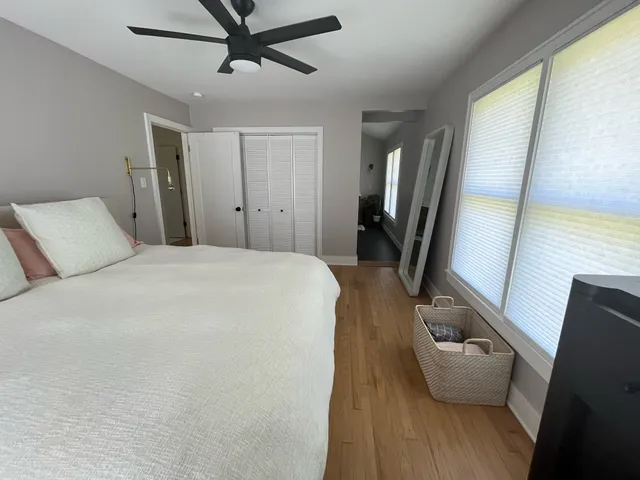 a living room with furniture and a mirror