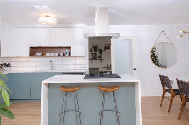 a kitchen with a refrigerator sink and stove