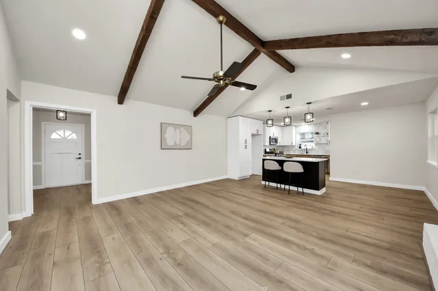 a view of kitchen and wooden floor