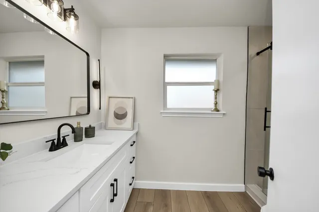 a bathroom with a sink and a mirror
