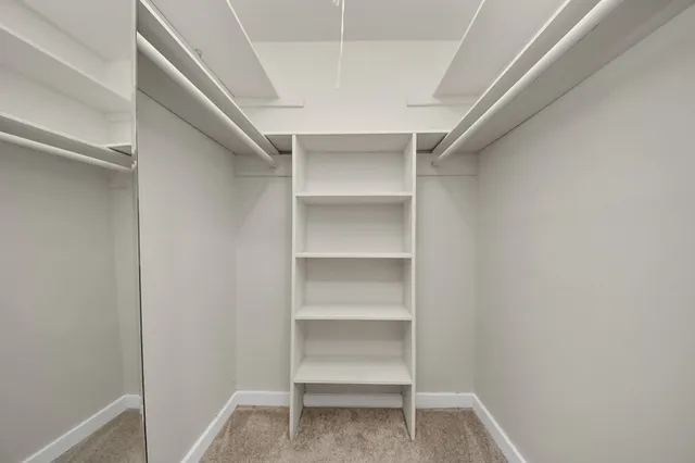 a view of an empty walk in closet