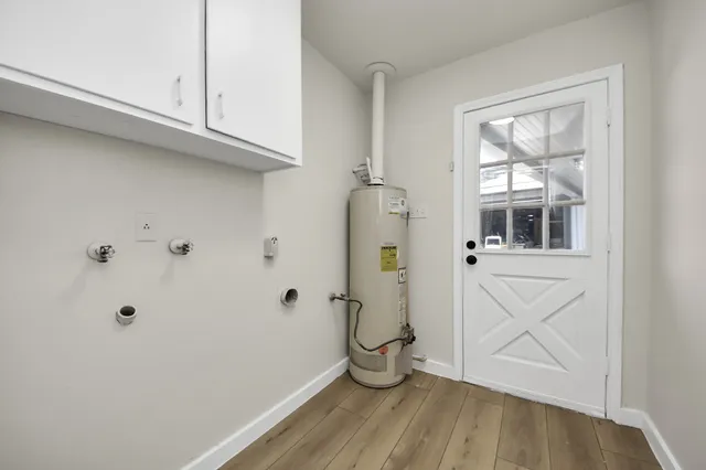 a bathroom with a window and a shower