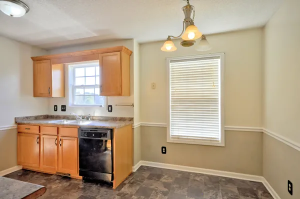a kitchen with a sink and a window