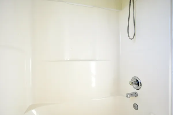 a bathroom with a bath tub