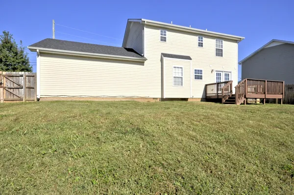 a view of a house with a big yard