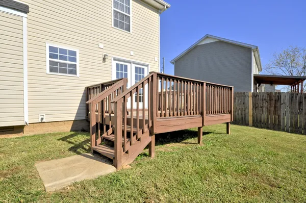 a view of a chair in backyard of house