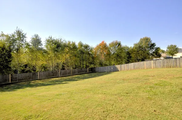 a view of a swimming pool with an outdoor space and seating area