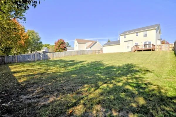 a view of a swimming pool and a yard