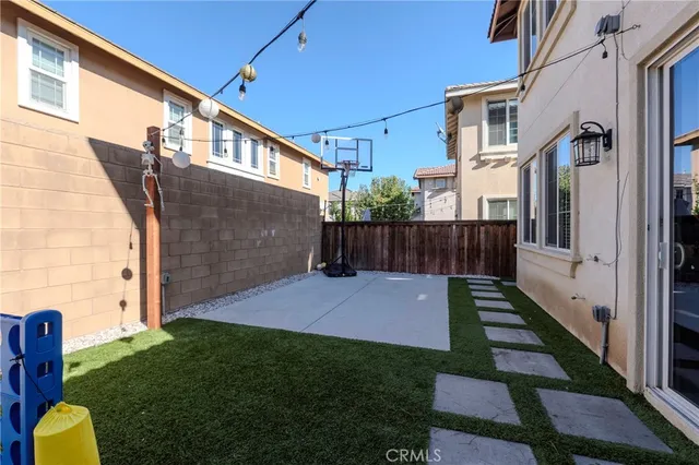 a view of backyard with patio