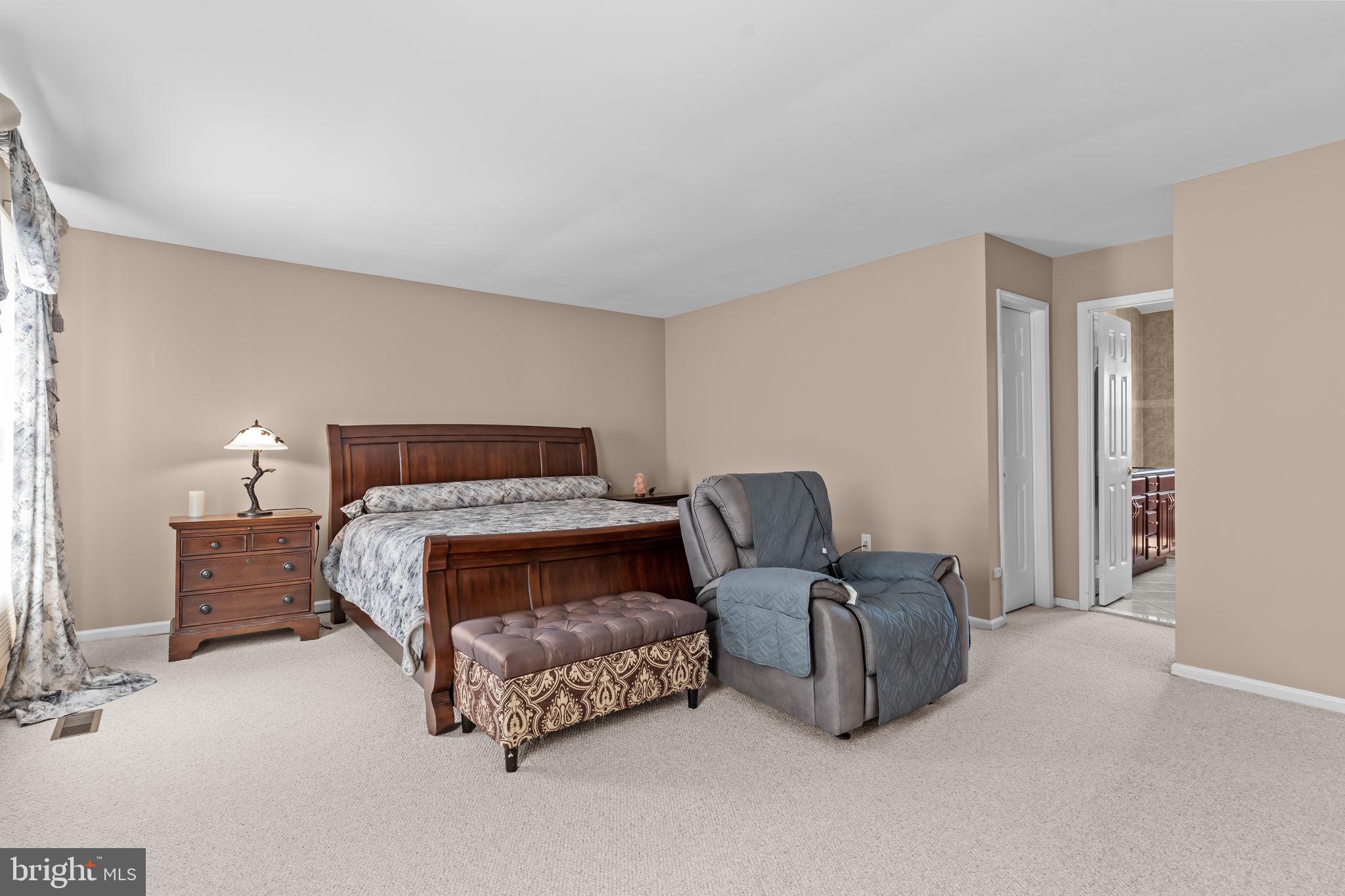 15 Roy Lane Huntingdon Valley, PA 19006 - Photo 19 of 45 a bedroom with a bed and couch