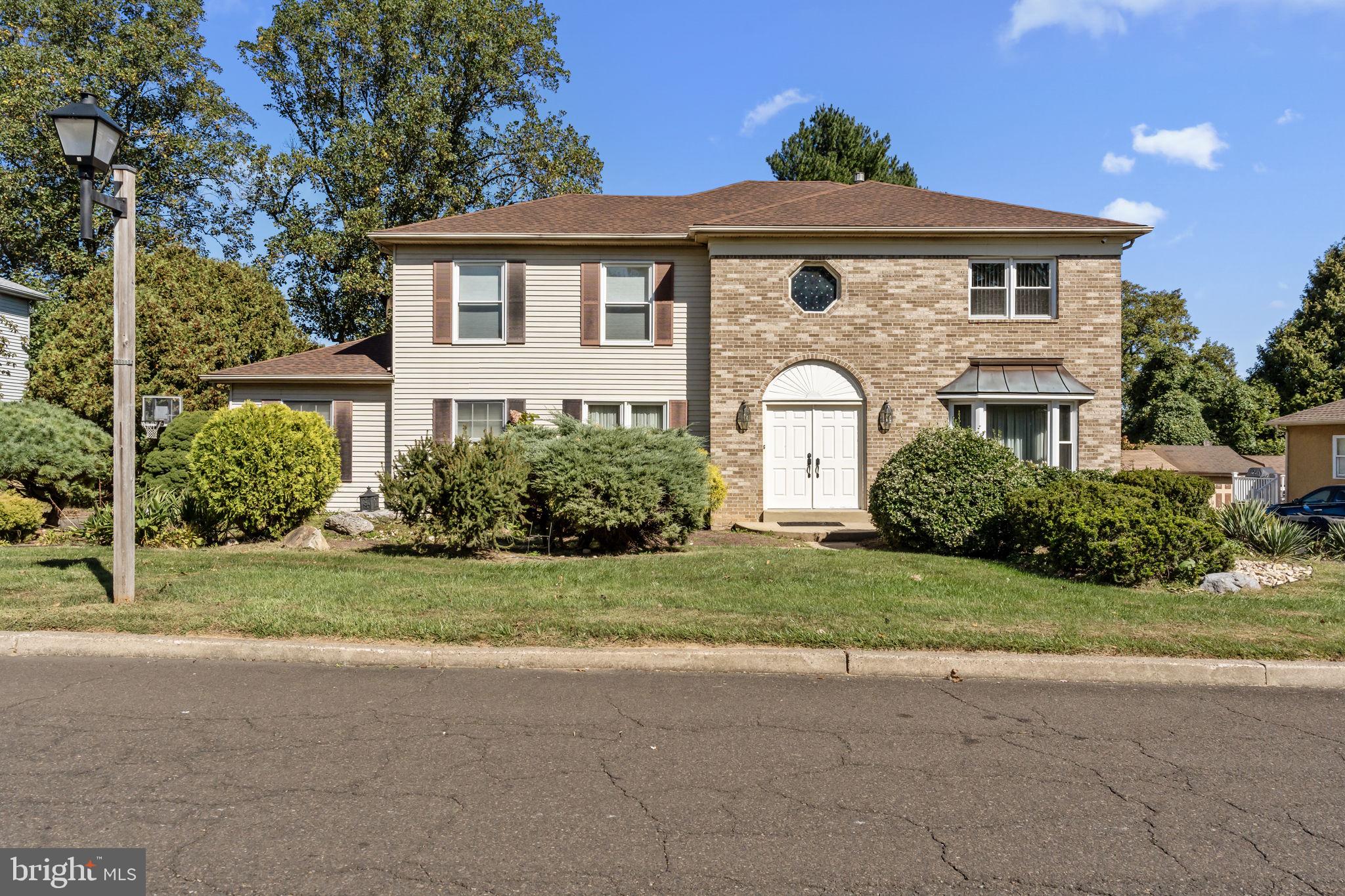 15 Roy Lane Huntingdon Valley, PA 19006 - Photo 2 of 45 a front view of a house with garden