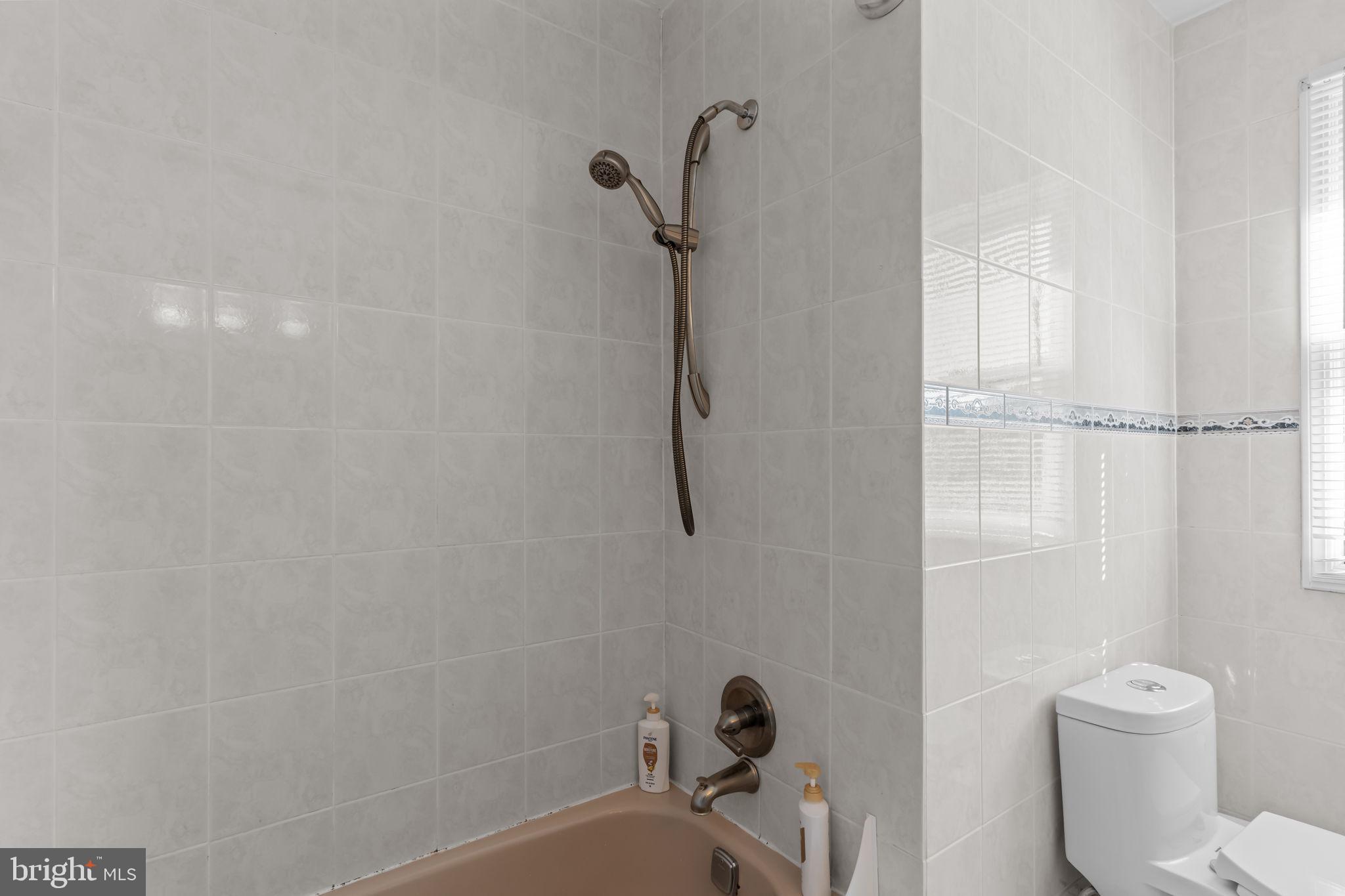 15 Roy Lane Huntingdon Valley, PA 19006 - Photo 27 of 45 a bathroom with a toilet and a bath tub