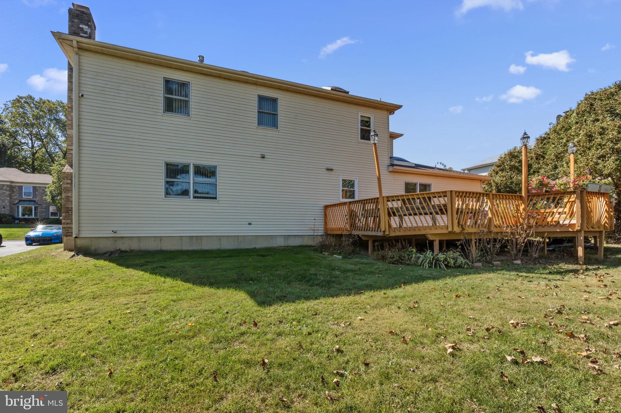 15 Roy Lane Huntingdon Valley, PA 19006 - Photo 44 of 45 a view of a house with backyard and sitting area