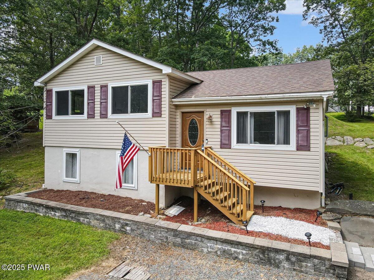 192 Heather Hill Road Dingmans Ferry, PA 18328 - Photo 1 of 74 a view of a house with a yard