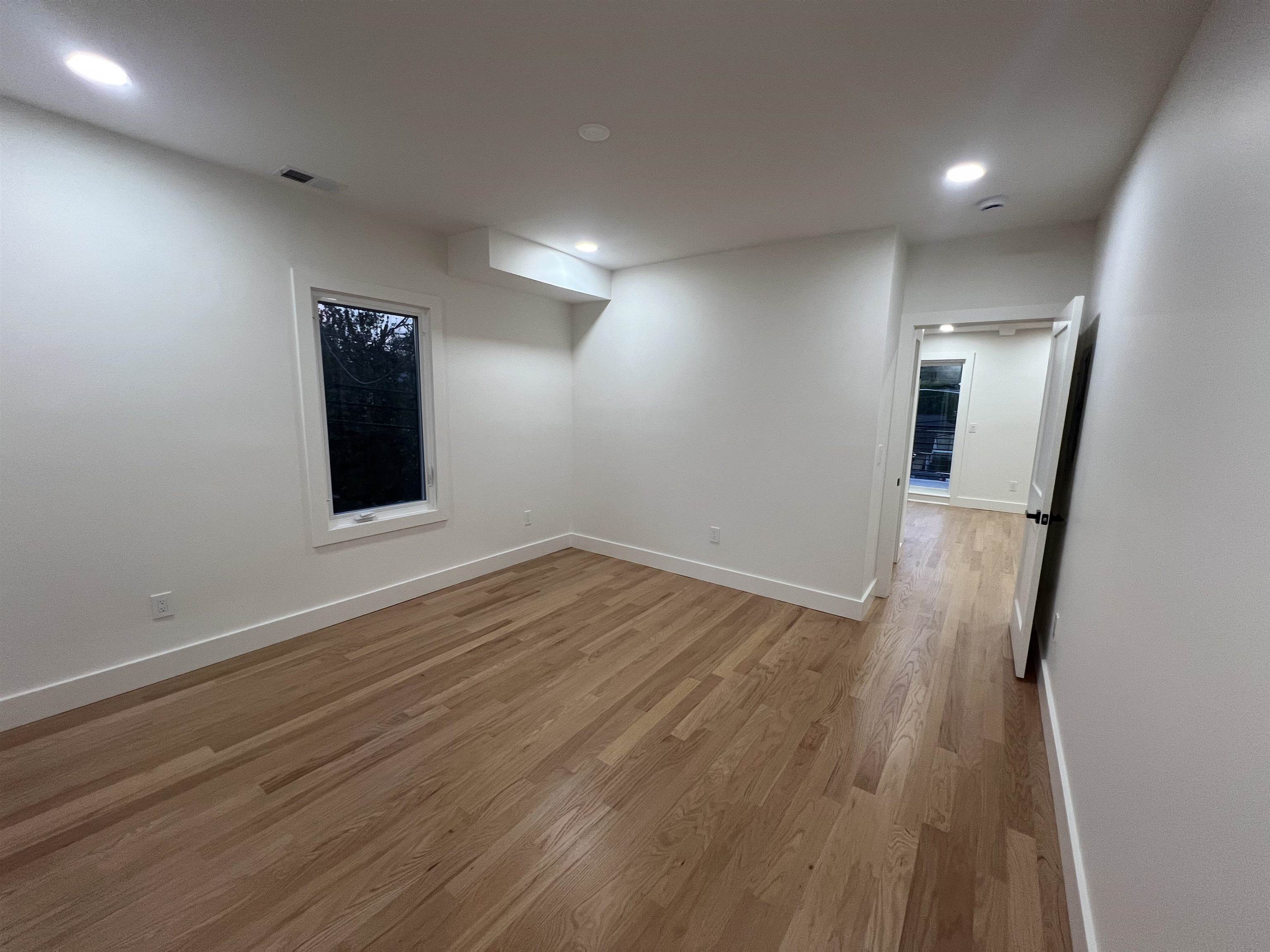 210 Waldo Place, Unit 2 Englewood, NJ 07631 - Photo 14 of 23 wooden floor in an empty room with a mirror