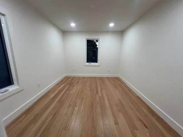 a view of wooden floor in an empty room