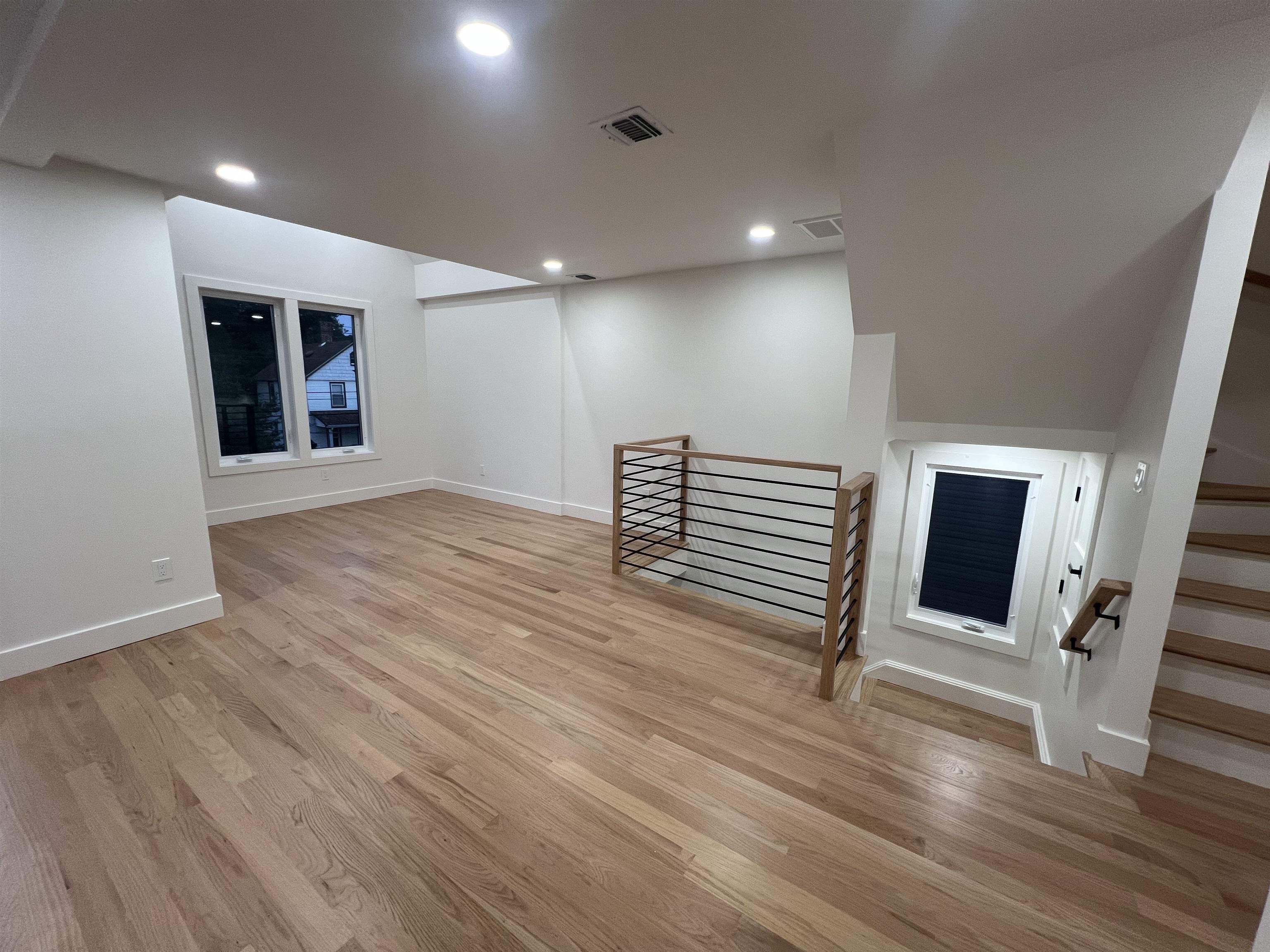 210 Waldo Place, Unit 2 Englewood, NJ 07631 - Photo 2 of 23 an empty room with wooden floor and windows