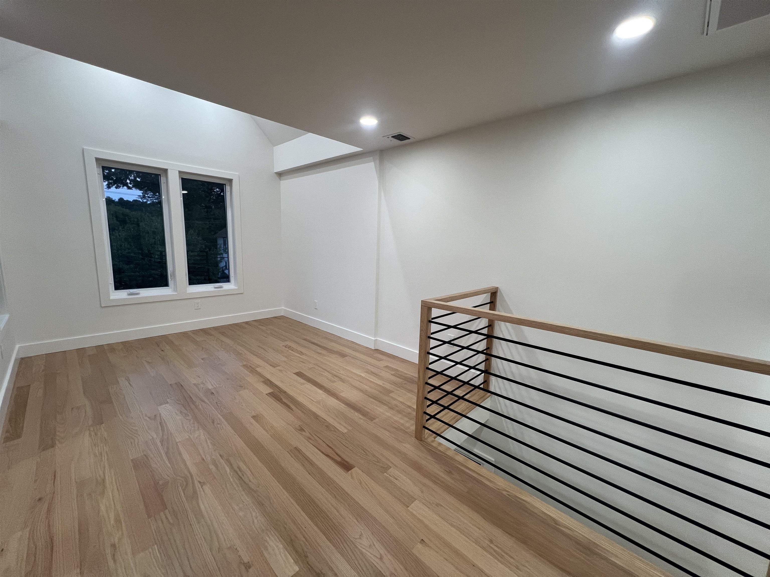 210 Waldo Place, Unit 2 Englewood, NJ 07631 - Photo 8 of 23 a view of wooden floor and windows in a room
