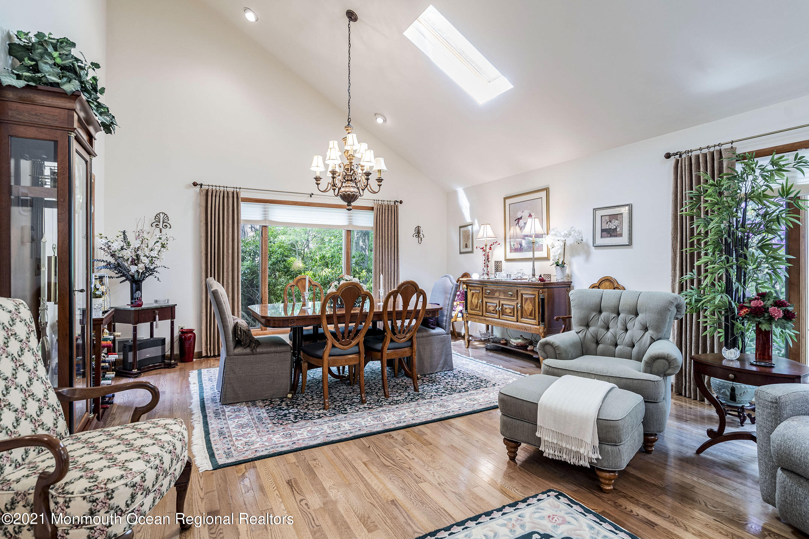 617 Turkey Point Road Brick, NJ 08724 - Photo 14 of 43 a living room with furniture chandelier and a fireplace