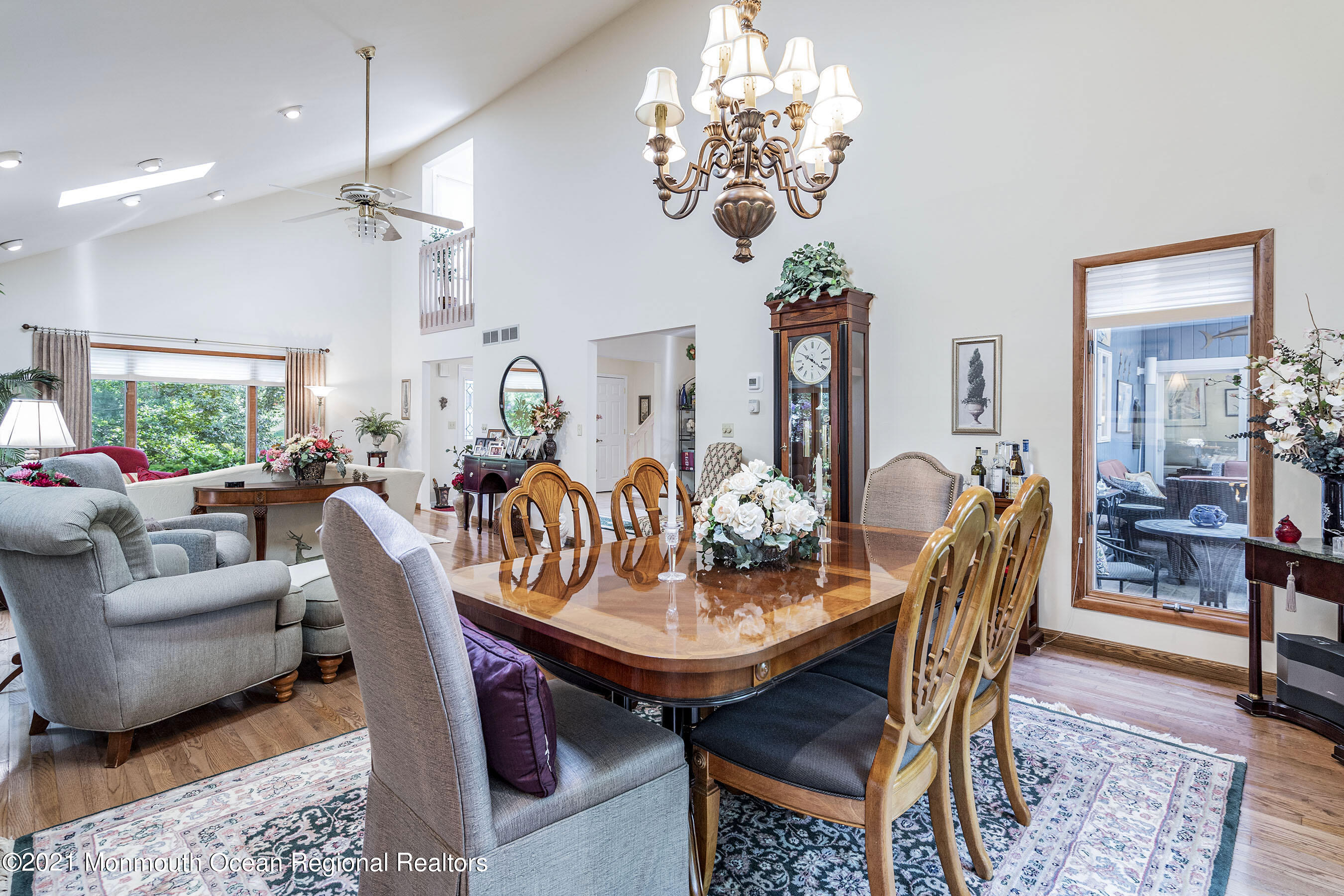 617 Turkey Point Road Brick, NJ 08724 - Photo 15 of 43 a view of a dining room with furniture a chandelier and wooden floor